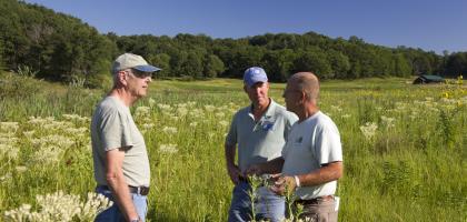A USFWS biologist meets with a group of landowners during a site visit at the SwampLovers Foundation property in Cross Plains, Wisconsin.