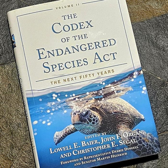 Hardcover book titled "The Codex of the Endangered Species Act: The Next Fifty Years, Volume II," edited by Lowell E. Baier, John F. Organ, and Christopher E. Segal, with a photograph of a sea turtle swimming near the water's surface on the cover.